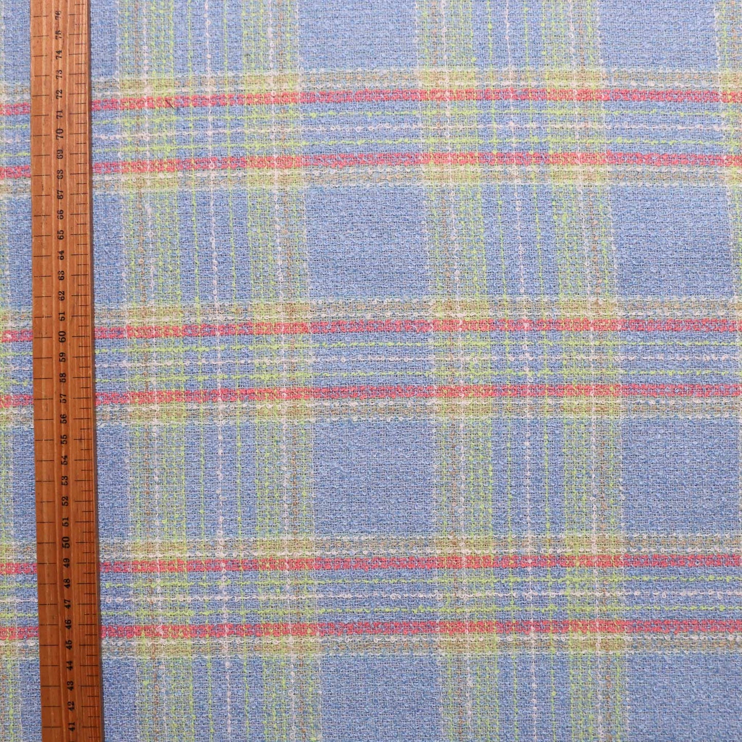 pale blue lime green and pink wool blend boucle dressmaking fabric with check pattern