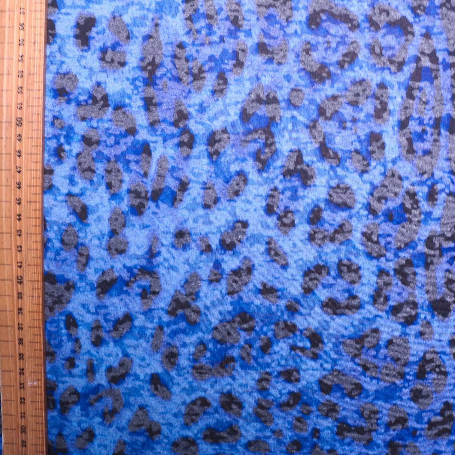 metre blue jersey knit stretchy dressmaking fabric with animal print