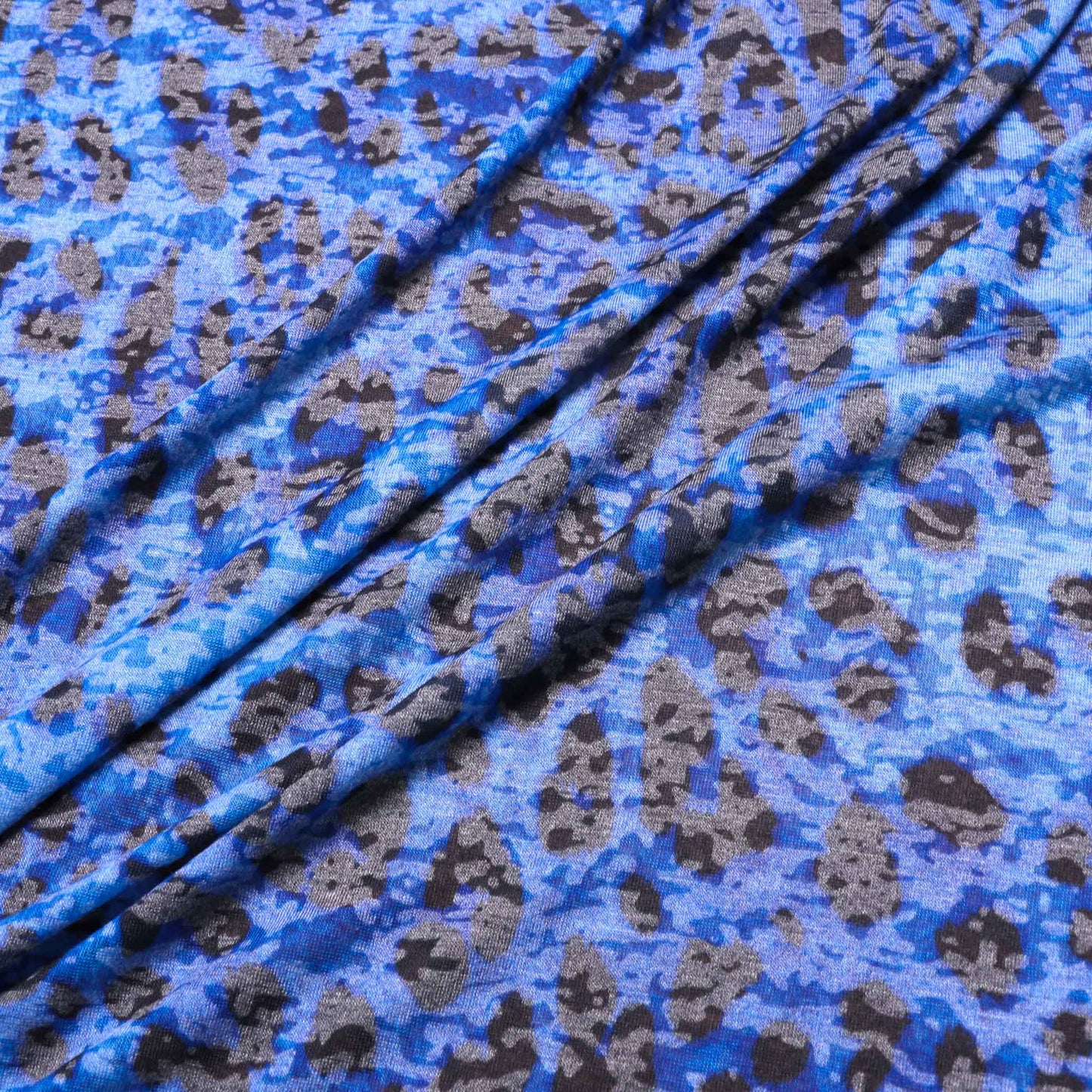 stretchy jersey knit dressmaking fabric in blue with animal print