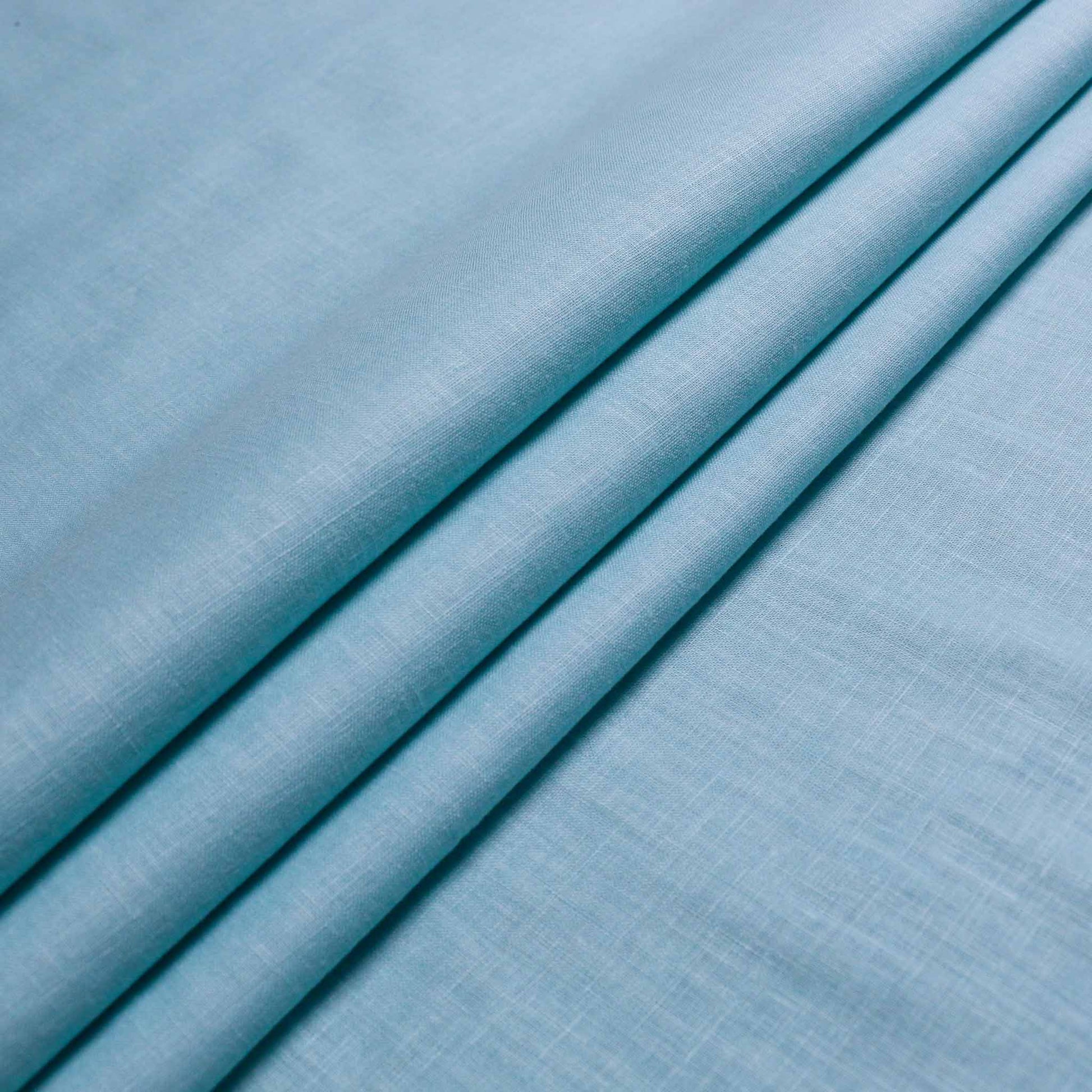 plain viscose cotton fabric for dressmaking in pale teal colour