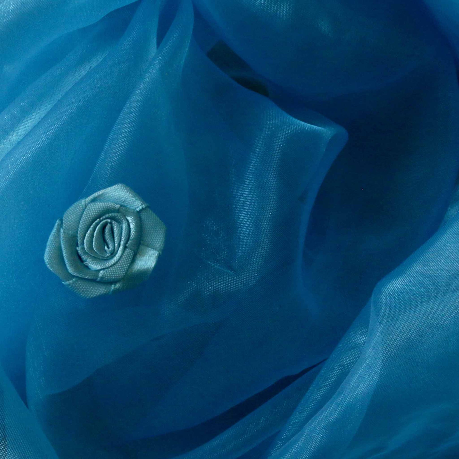 blue organza dressmaking fabric with rose embellishment