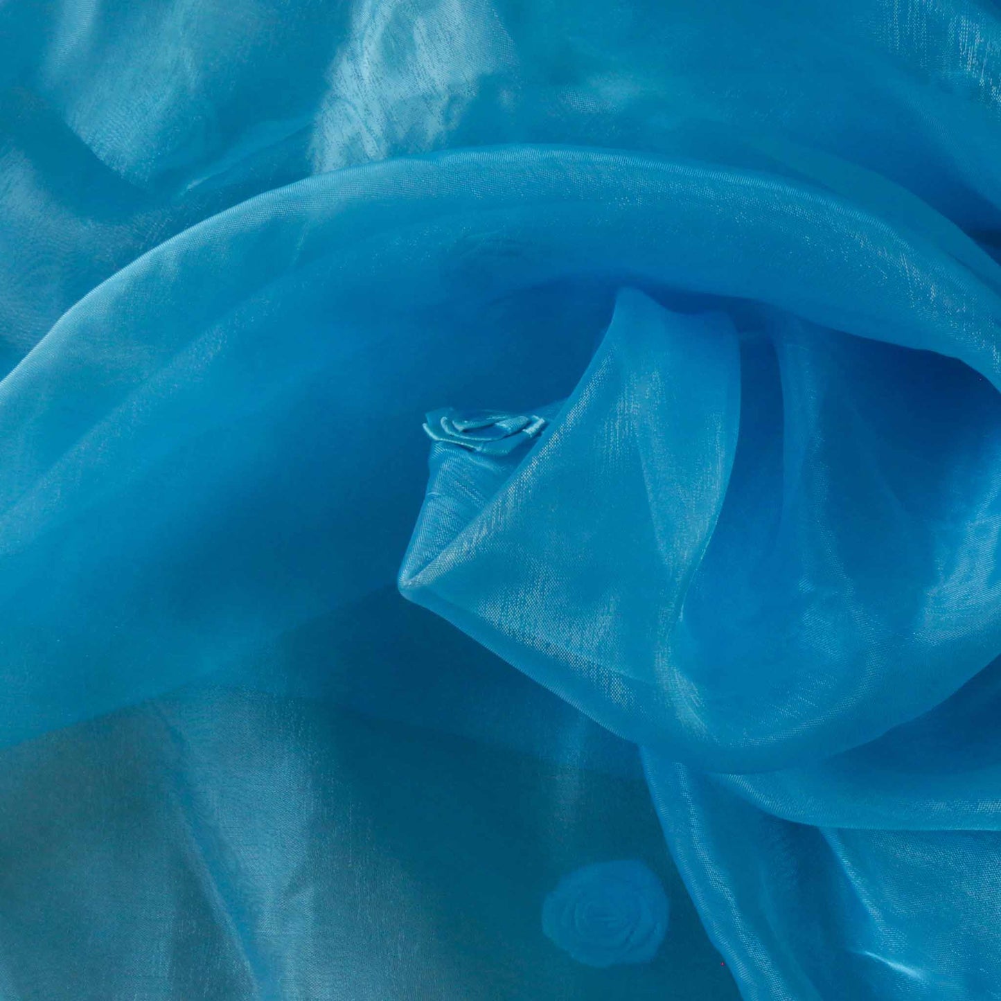 pale blue organza fabric for dressmaking with rose embellishment 