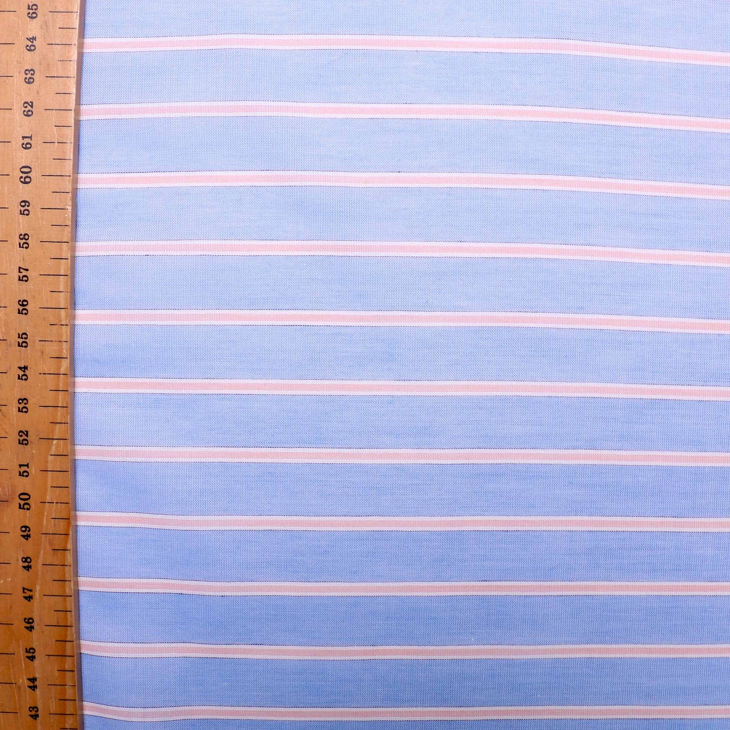 metre cotton lawn voile dressmaking fabric with pink stripes on blue base