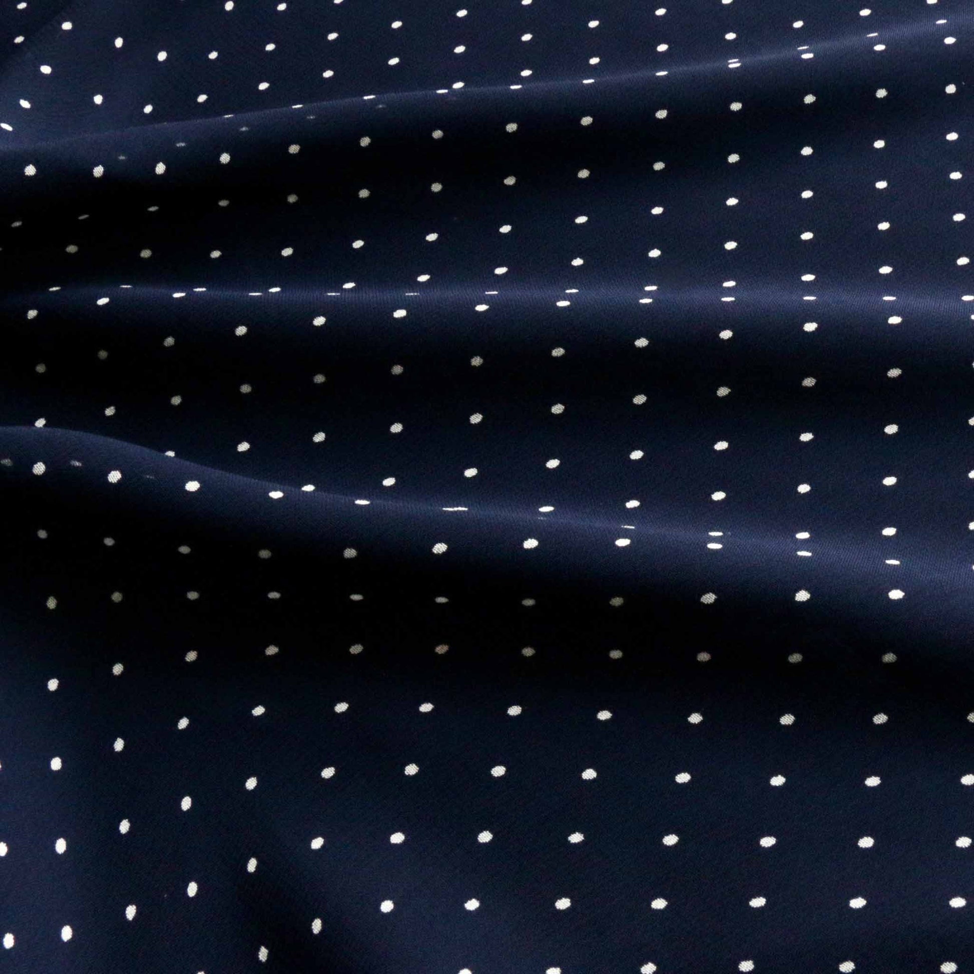 blue and white polka dots on viscose chiffon dressmaking fabric