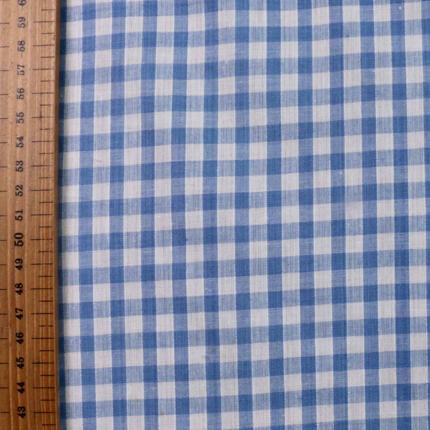 metre blue sustainable deadstock cotton dressmaking fabric with gingham pattern