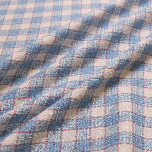 boucle dressmaking fabric in baby blue and white with check pattern