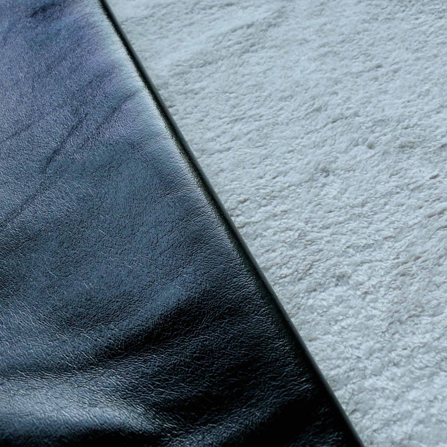 bonded black ovc with cream sherpa fleece backing dressmaking fabric