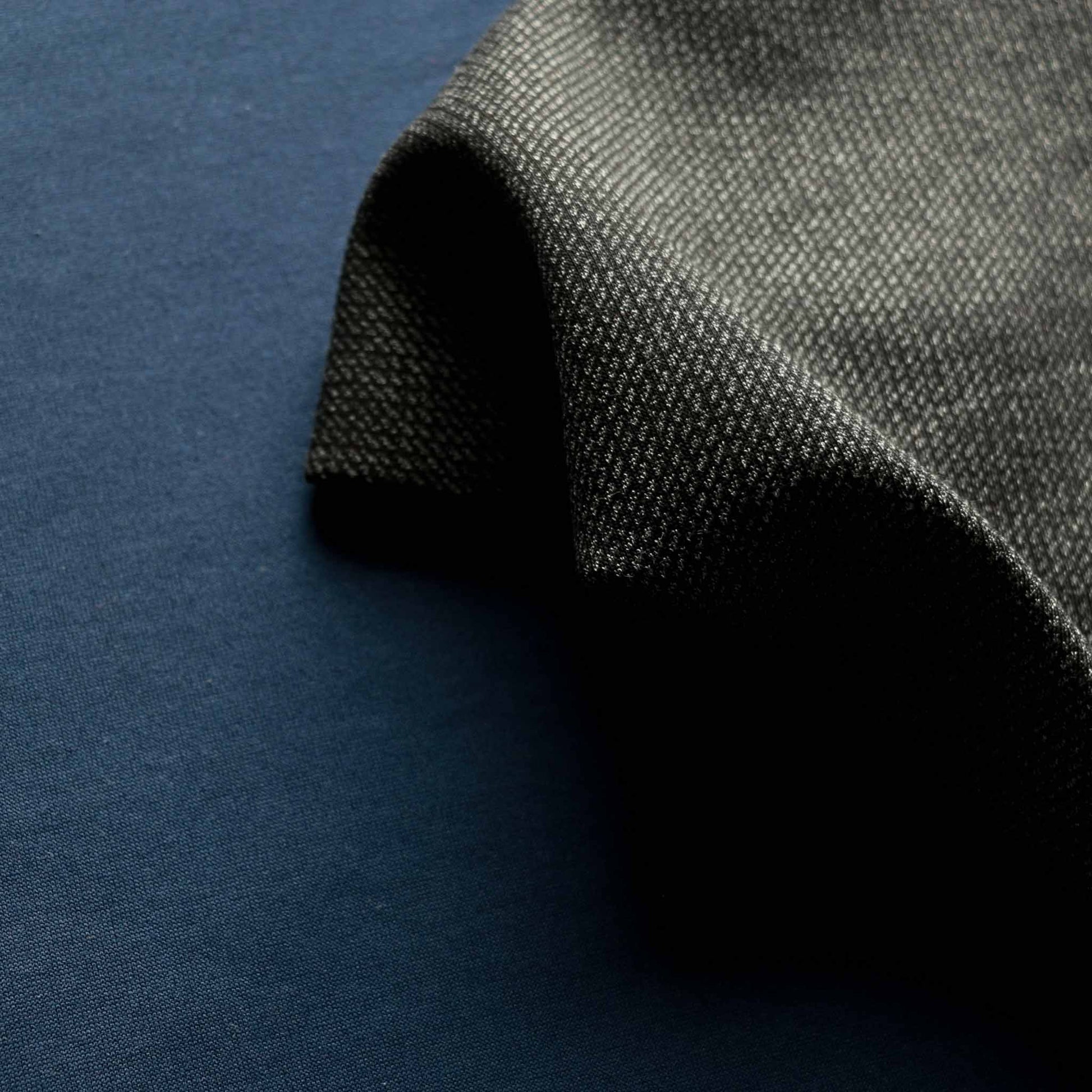 bonded black and grey wool jersey dressmaking fabric