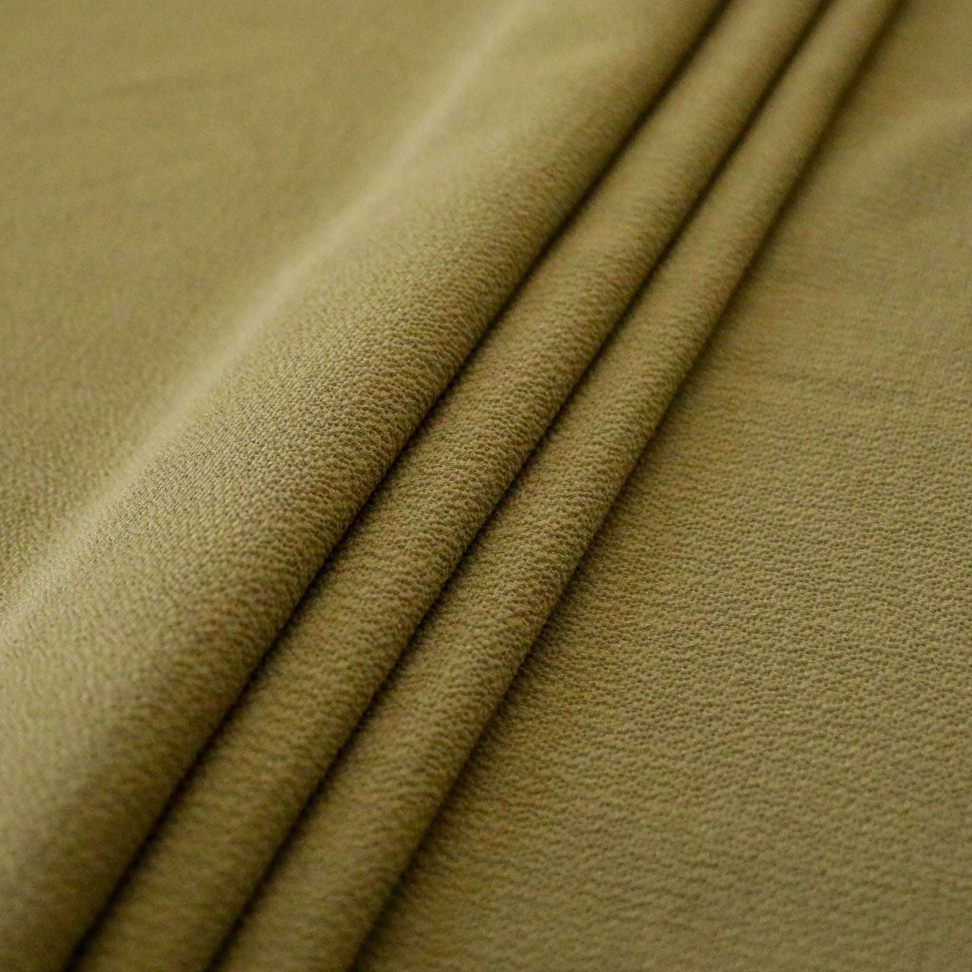 folded plain green bubble crepe fabric for dressmaking