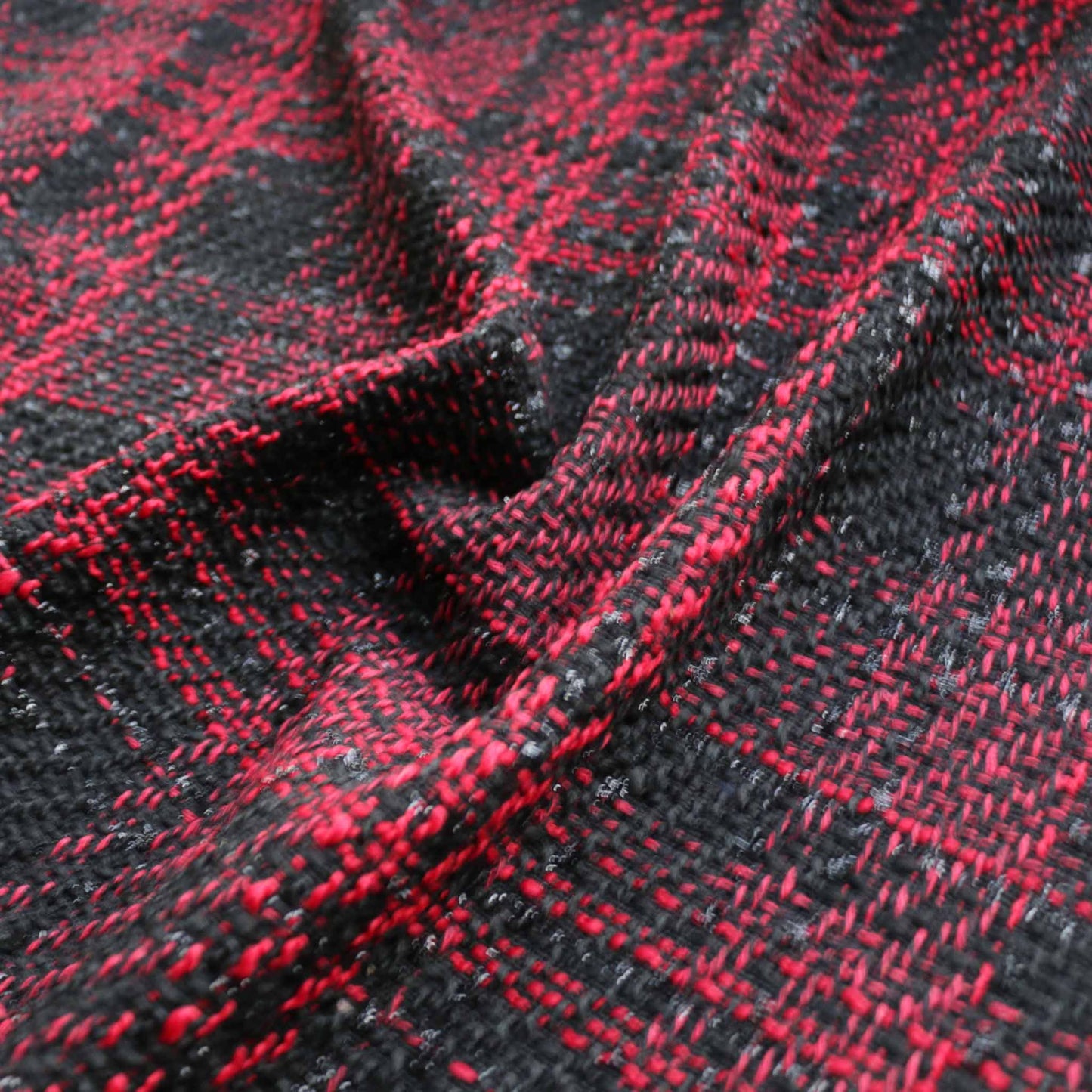 synthetic red and black boucle dressmaking fabric with lurex yarn