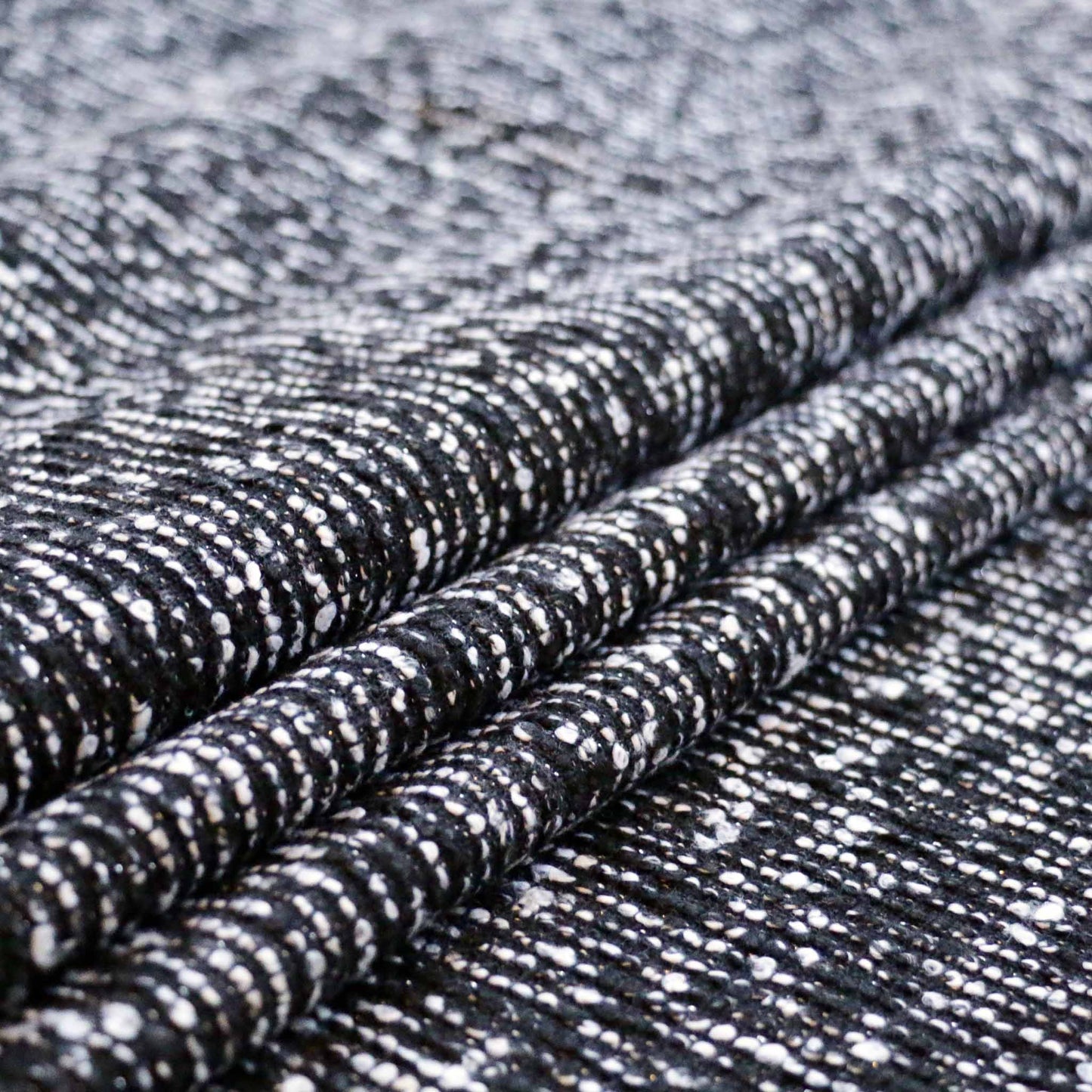 black wool blend boucle dressmaking fabric with silver lurex