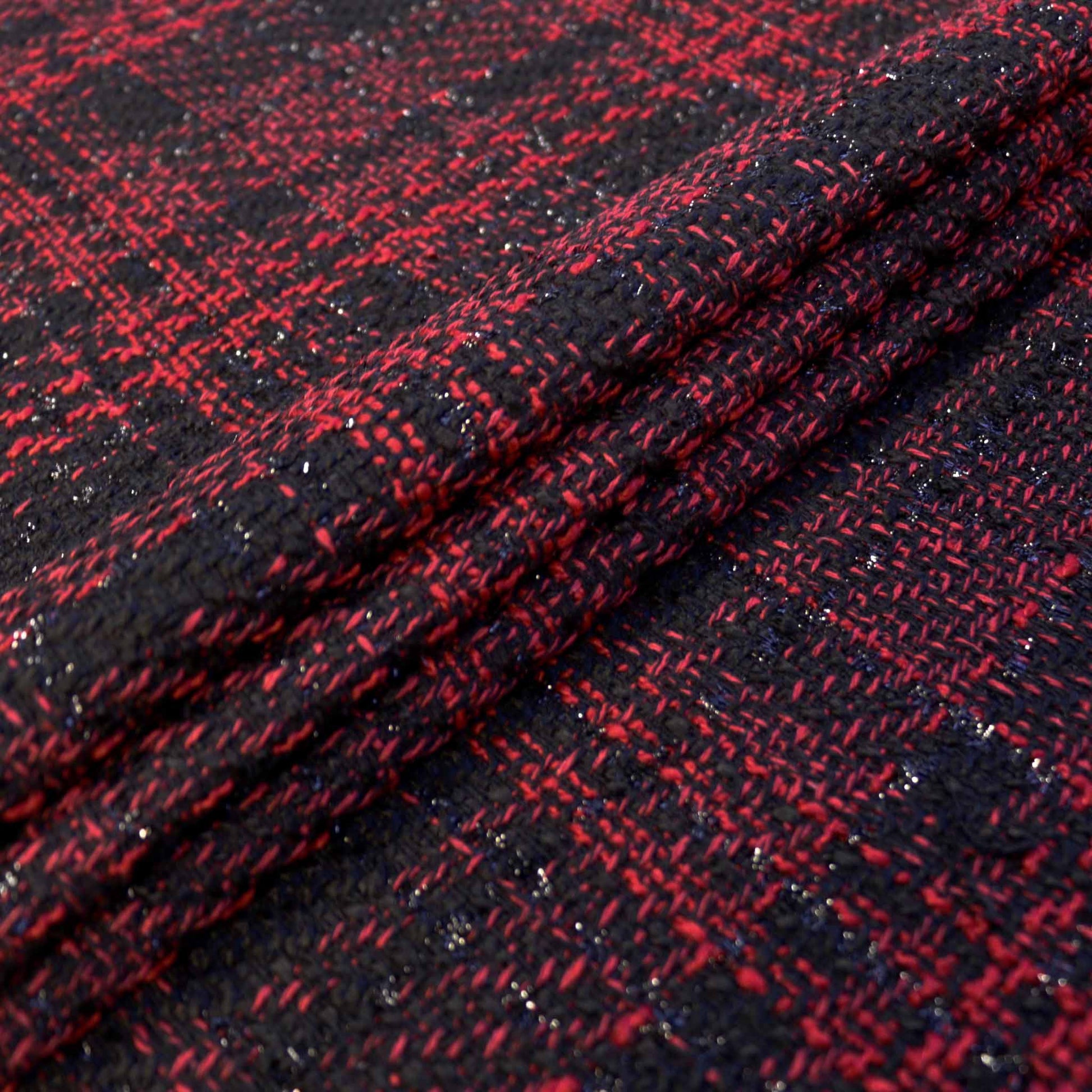folded red and black check synthetic boucle dressmaking fabric with lurex yarn