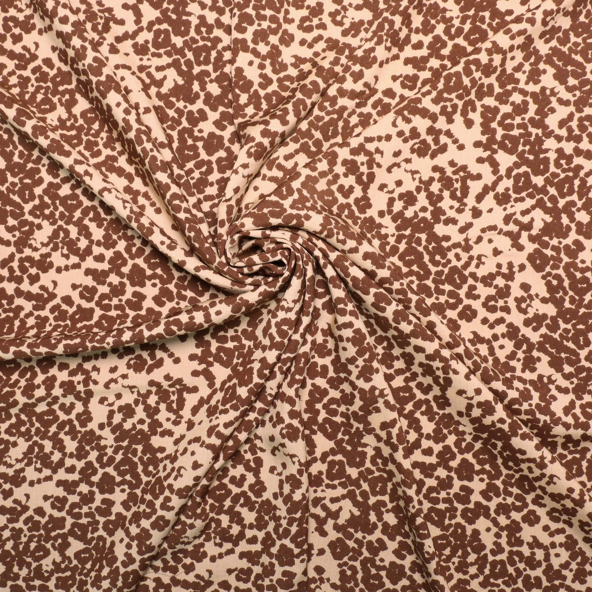 brown animal print on beige viscose challis dressmaking fabric