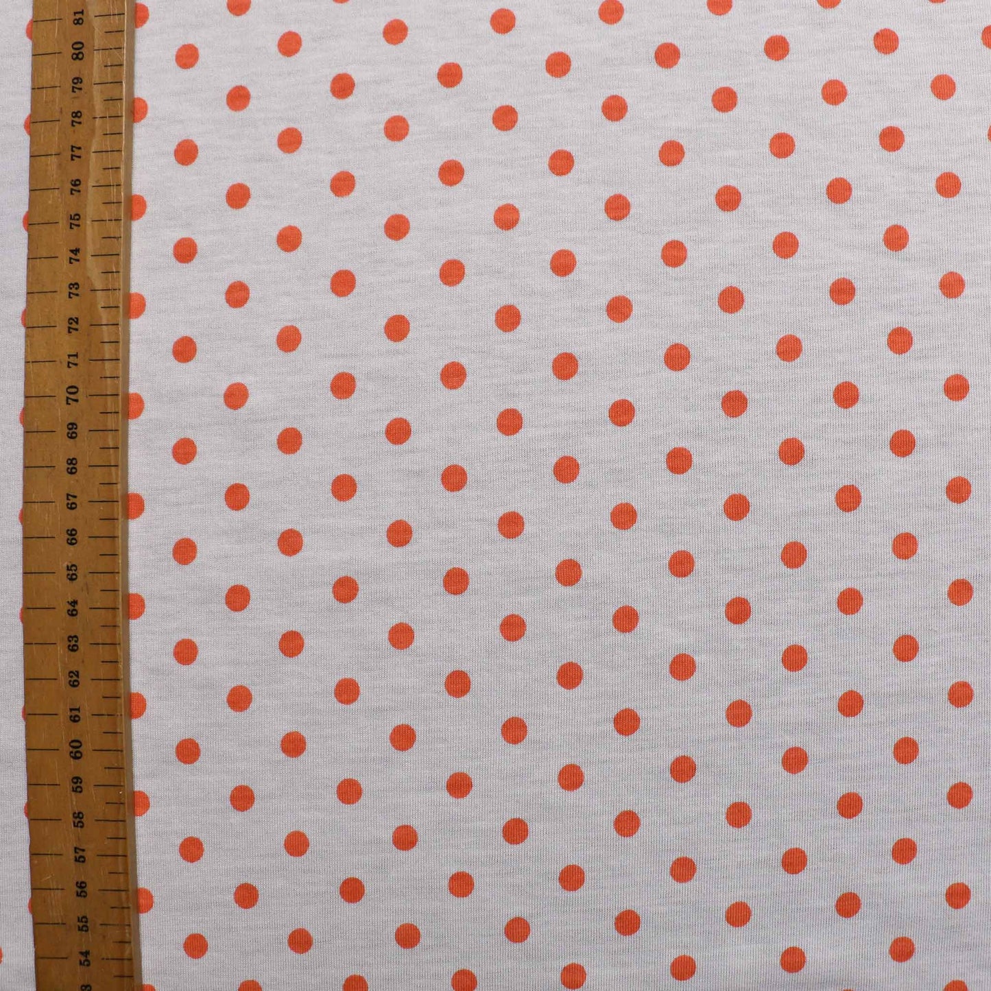 cloth controls coral orange and white polkadot jersey dressmaking fabric