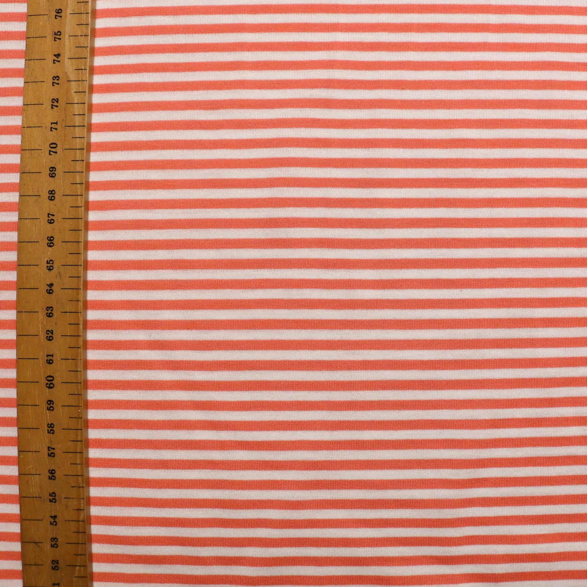 fabric with coral orange stripes for dressmaking from cloth control