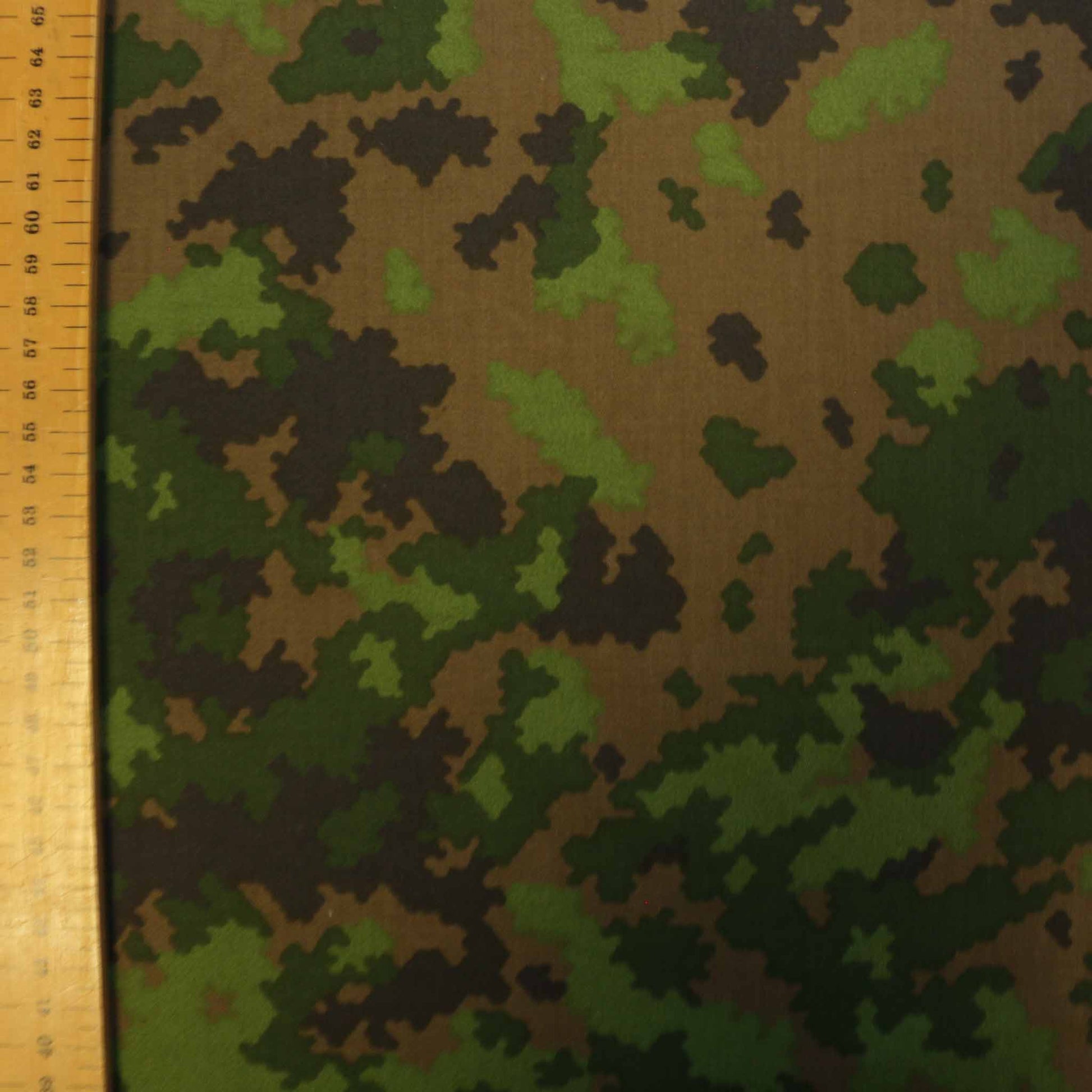 metre green camouflage dressmaking fabric in green with brown pattern
