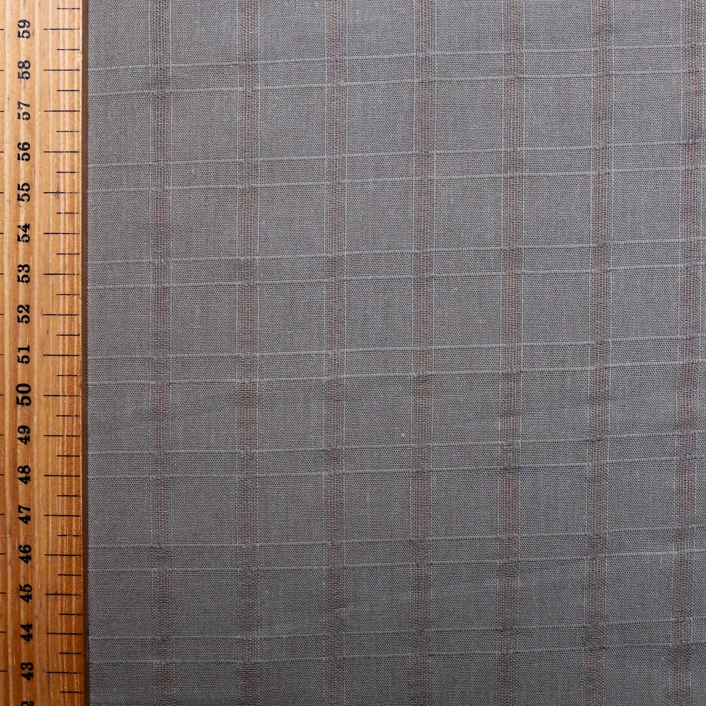 metre of brown cotton dressmaking fabric with jacquard check pattern