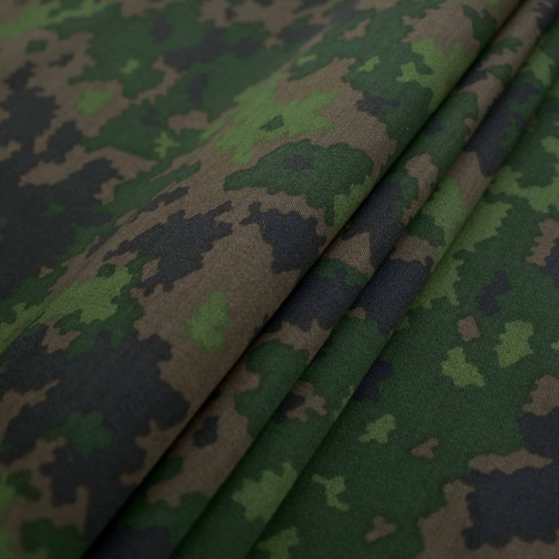 folded camouflage green and brown dressmaking cotton fabric