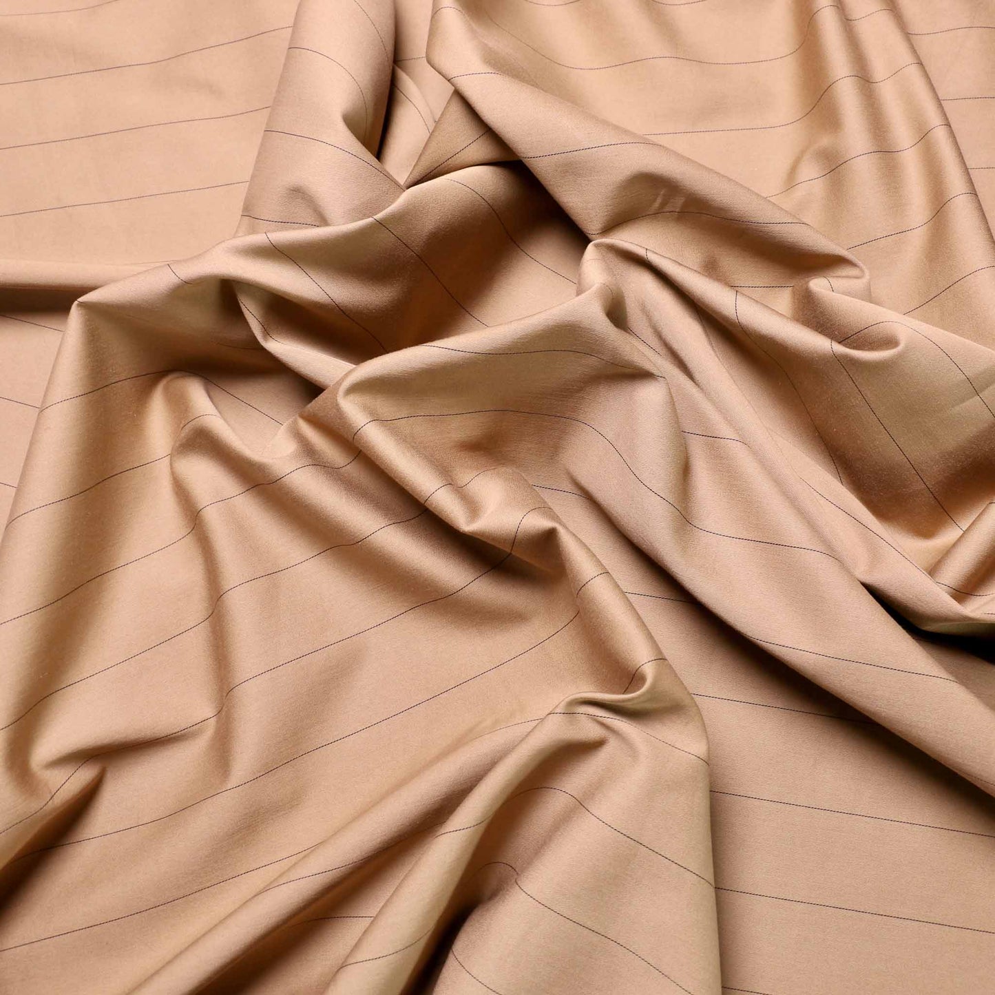 cotton sateen dressmaking fabric in beige with black pinstripe design