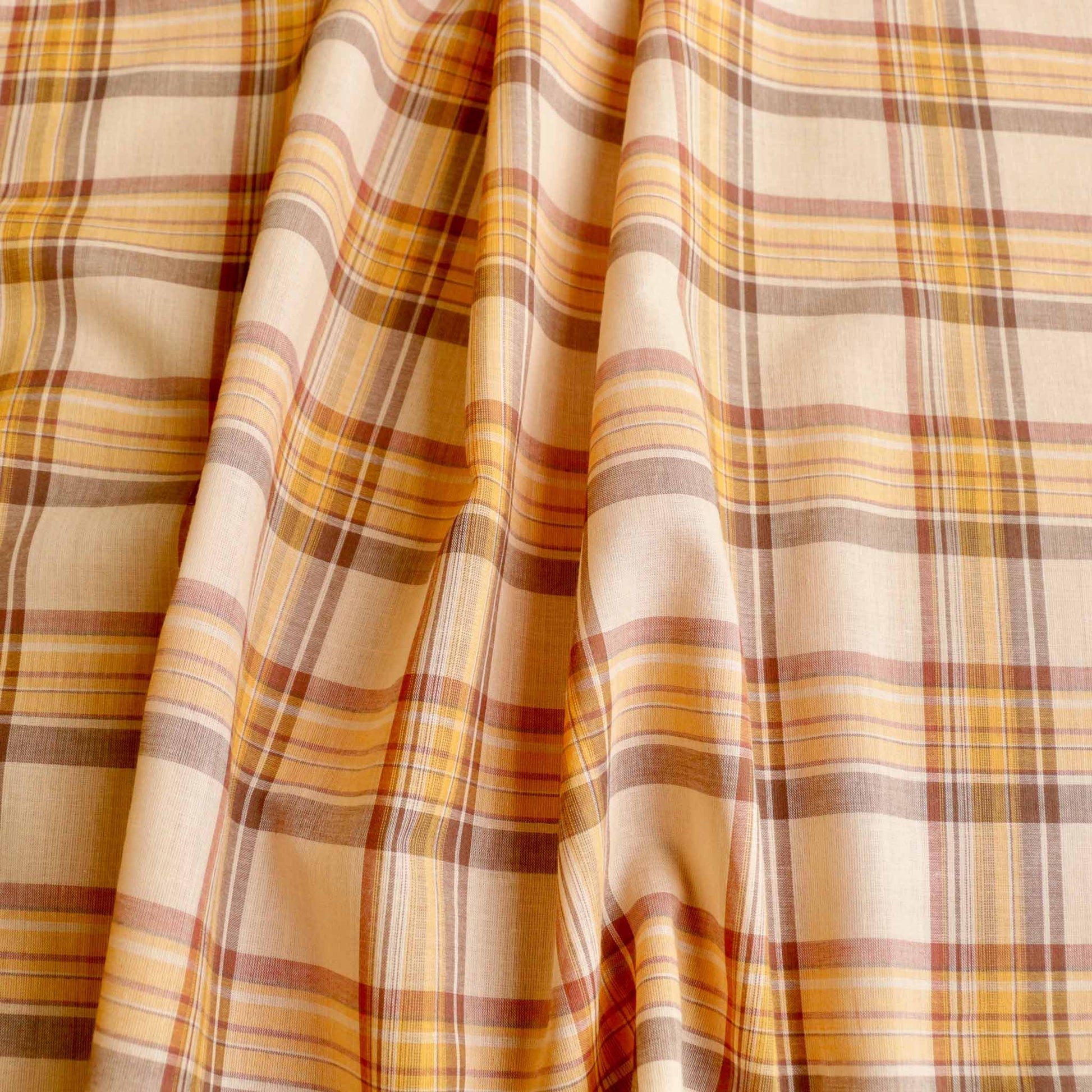 pale cotton voile dressmaking fabric with vintage style check print