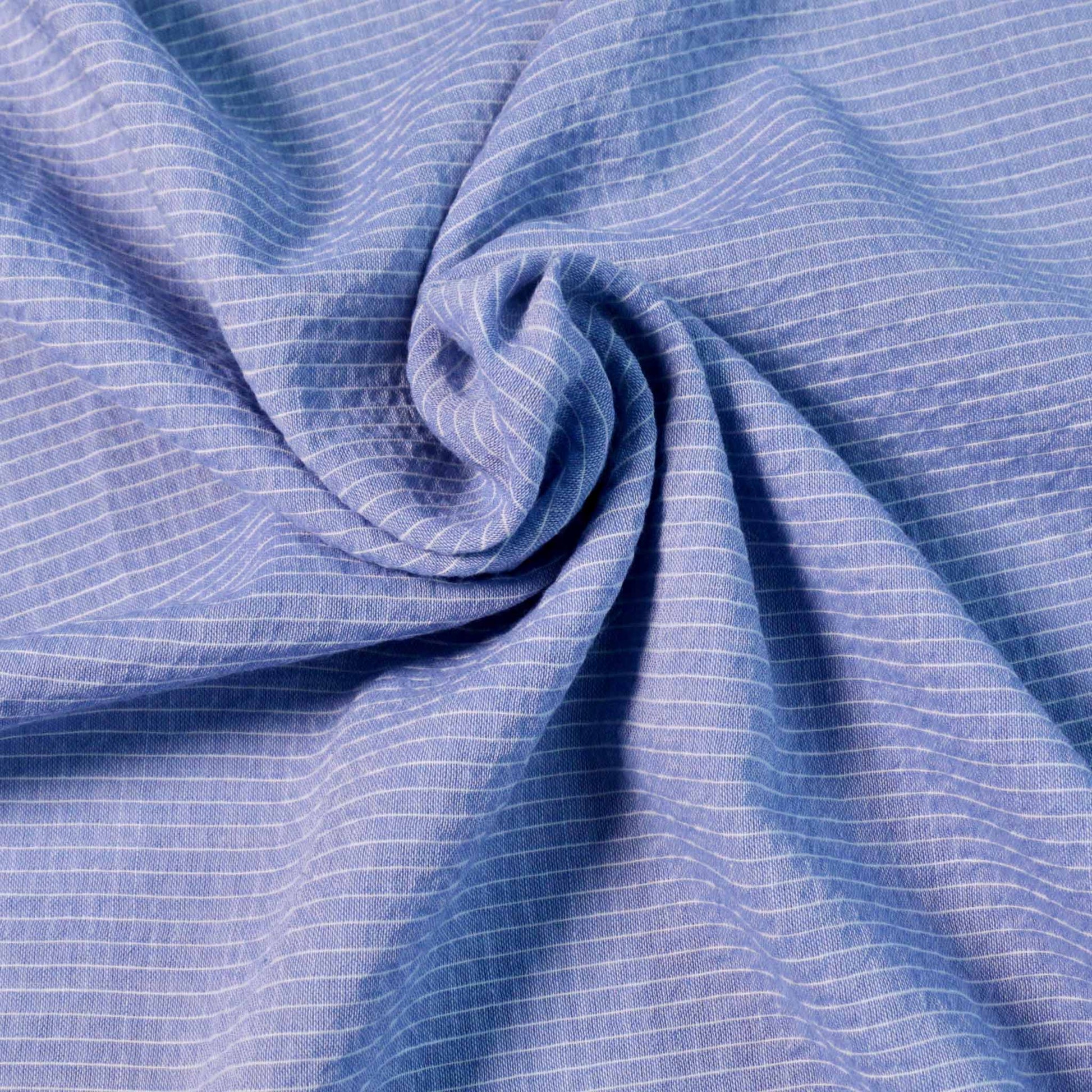 cotton voile lawn dressmaking fabric with tripe design in blue