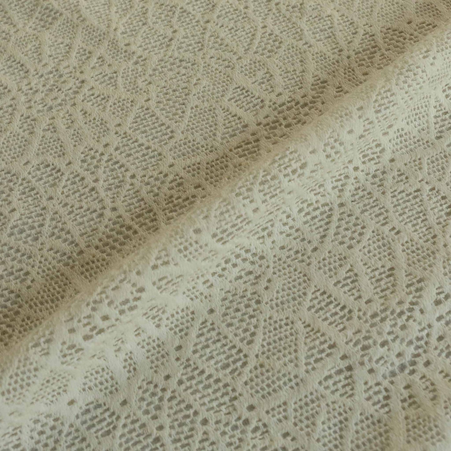 embroidery lace dressmaking fabric in cream colour