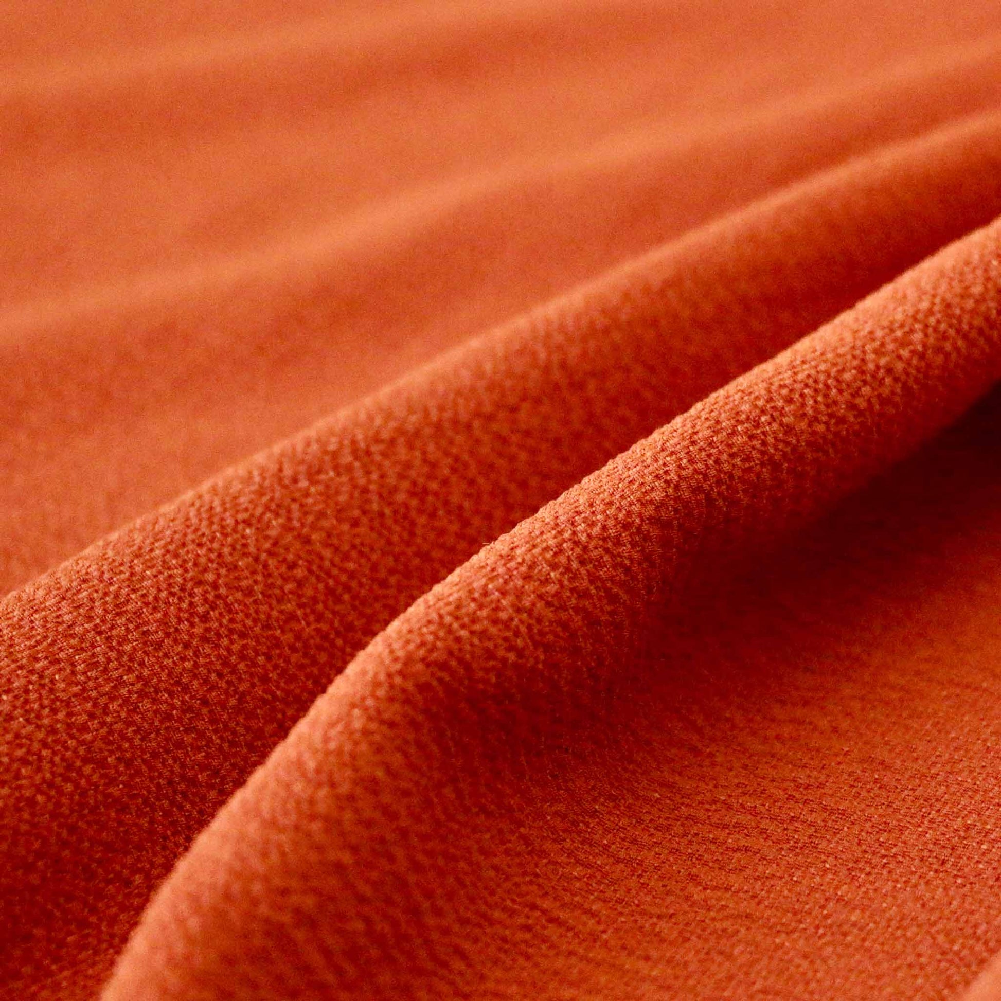 bubble crepe dress fabric in light orange colour for dressmaking