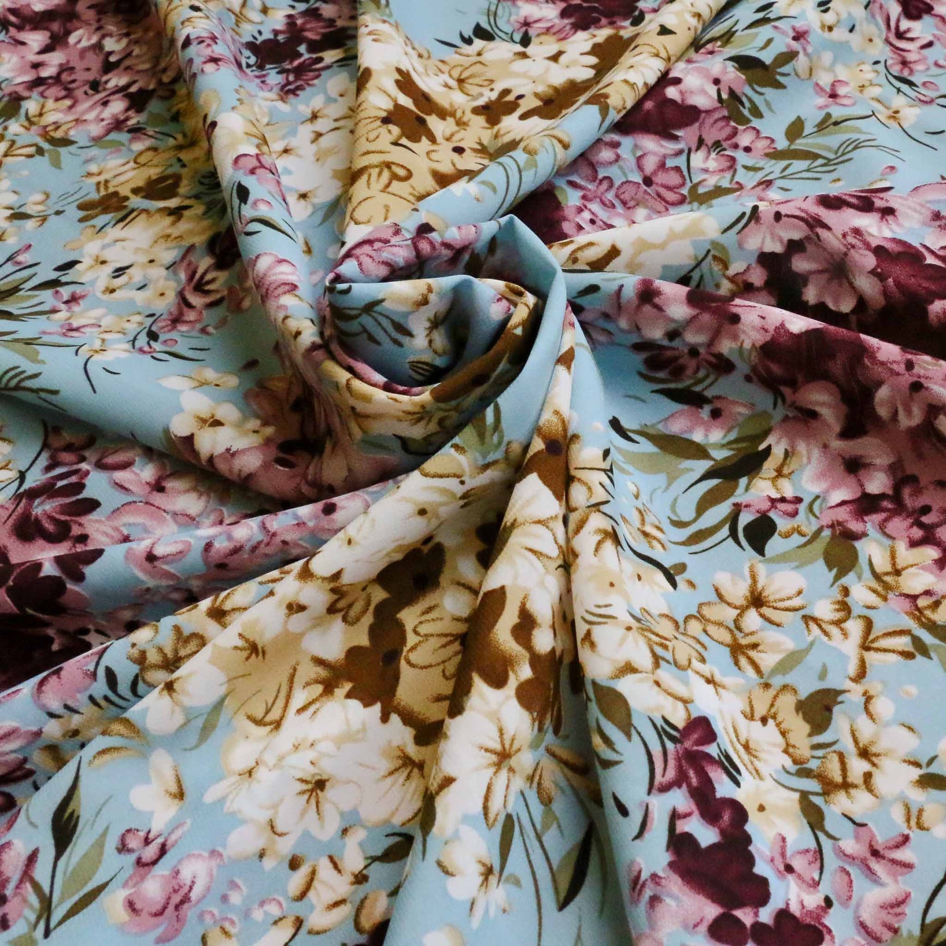 pastel coloured floral blue and maroon chiffon polyester dressmaking fabric