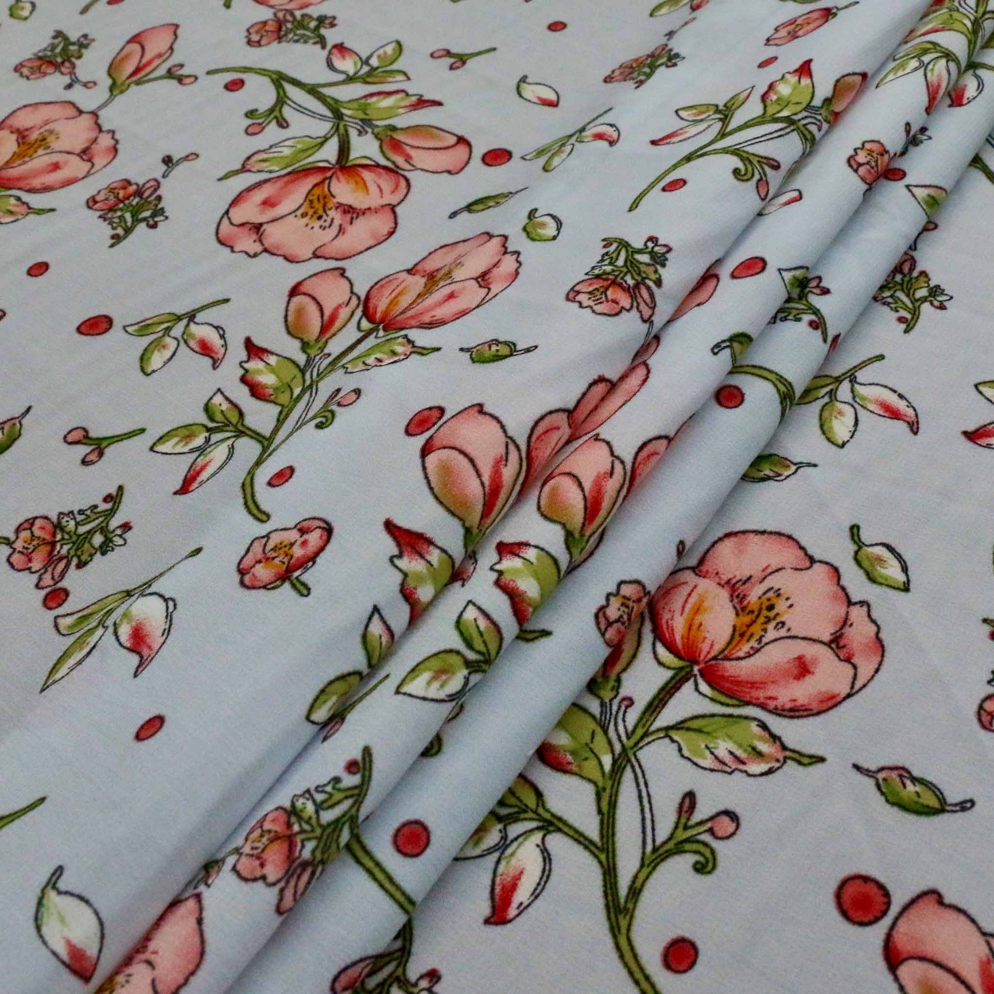 pink flower print on pale blue stretchy chiffon polyester dressmaking fabric