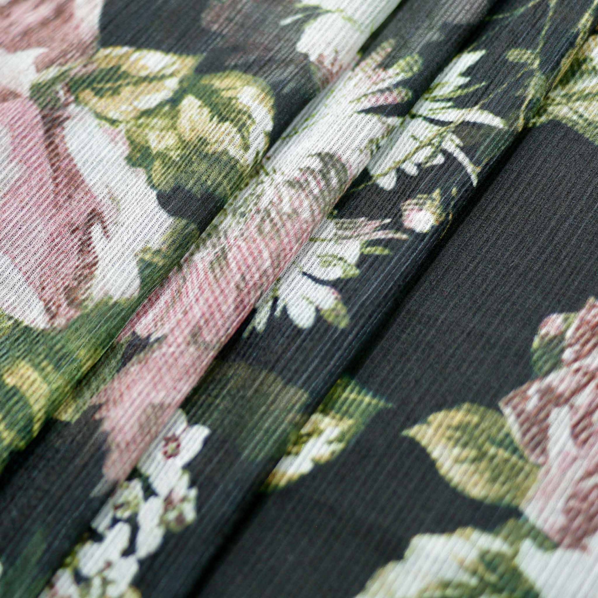 folded black and pink floral crinkle chiffon polyester dressmaking fabric