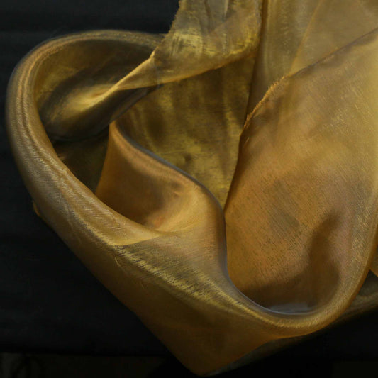 gold and black organza two tone dressmaking fabric