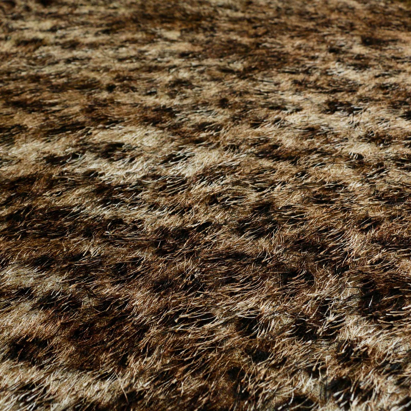 eyelash dressmaking fabric with golden brown jaguar print animal skin pattern