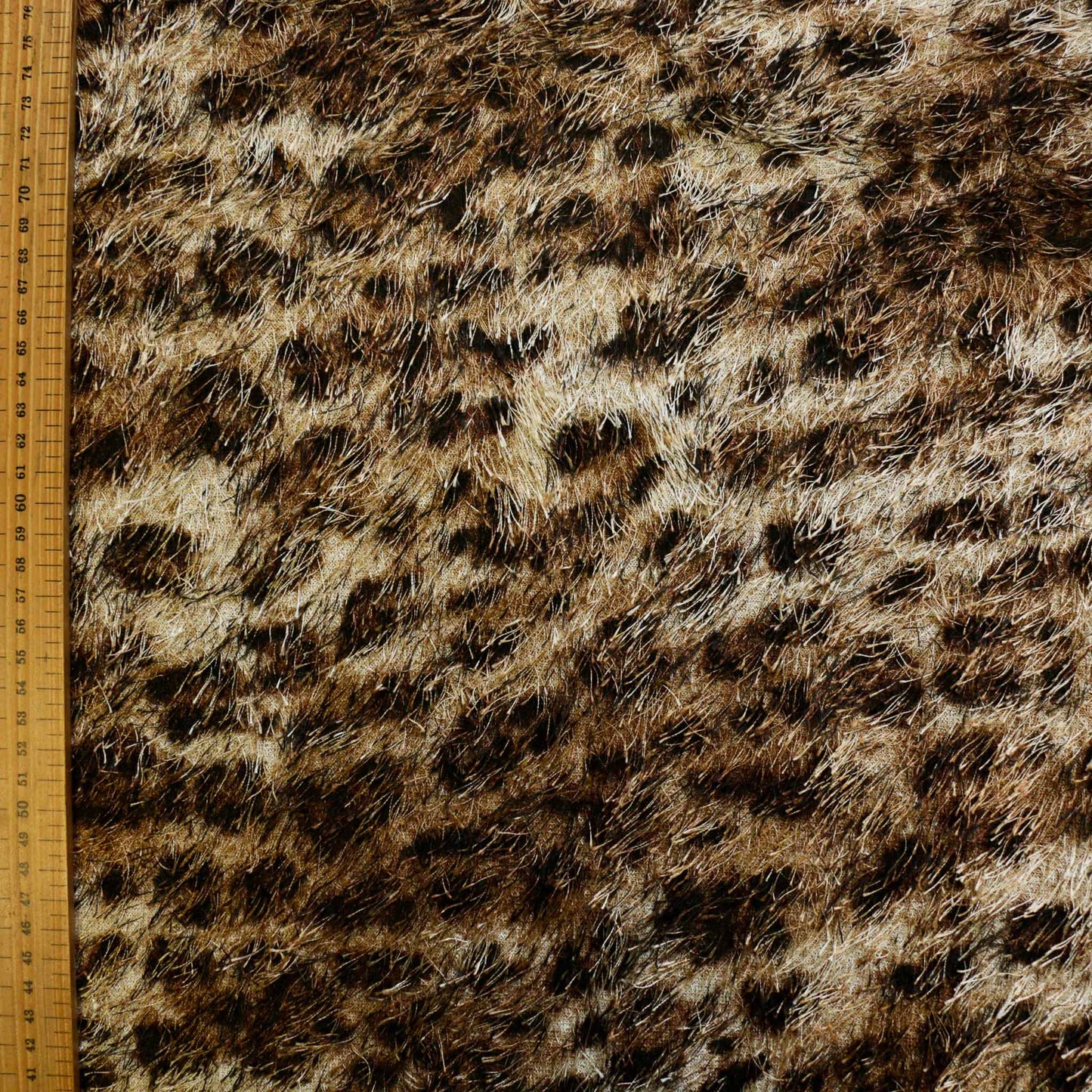metre animal print jaguar skin eyelash dressmaking fabric in golden brown