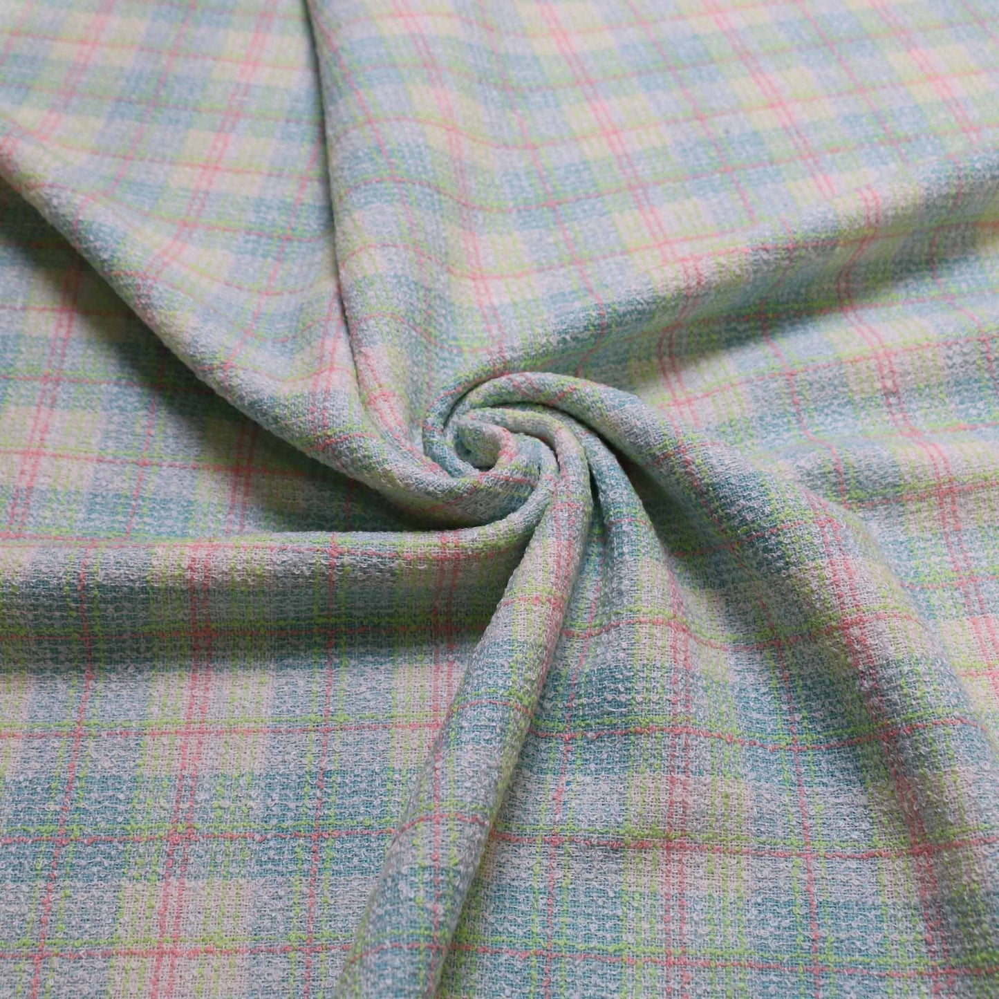 pale green boucle wool blend dressmaking fabric with blue and pink check pattern