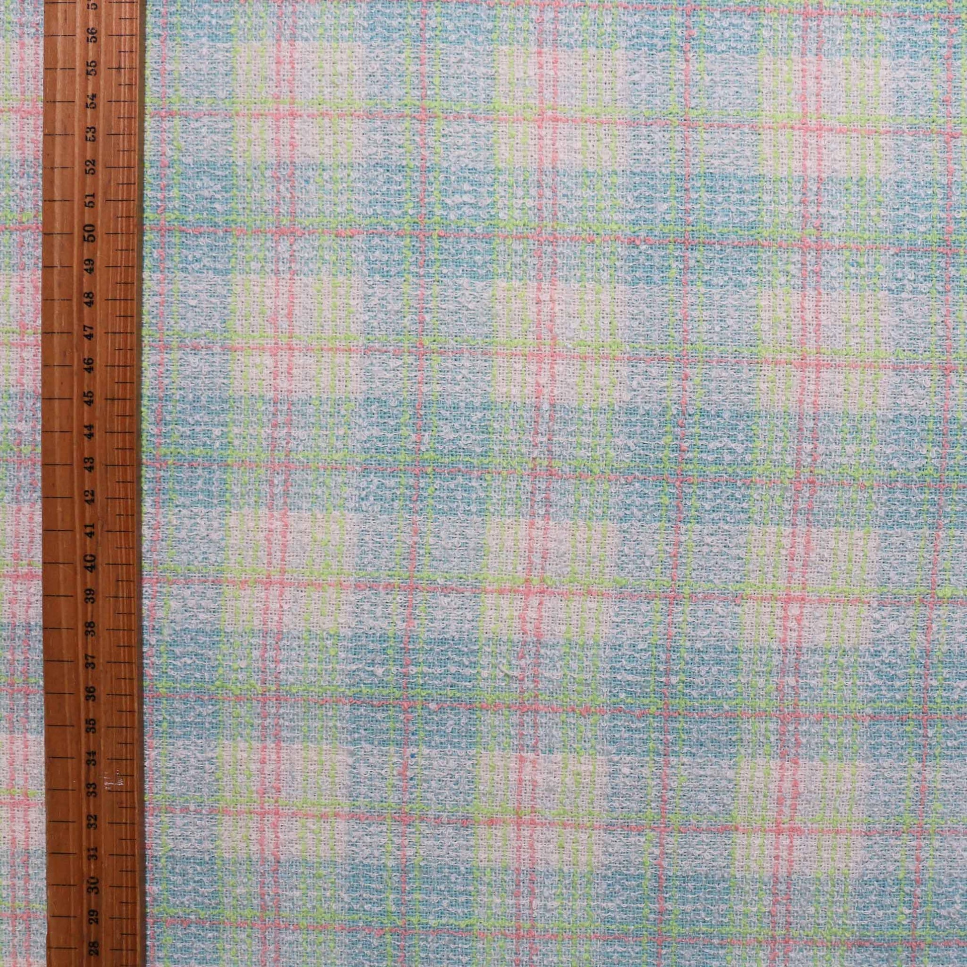 wool blend pale green boucle fabric with blue and pink check design for dressmaking