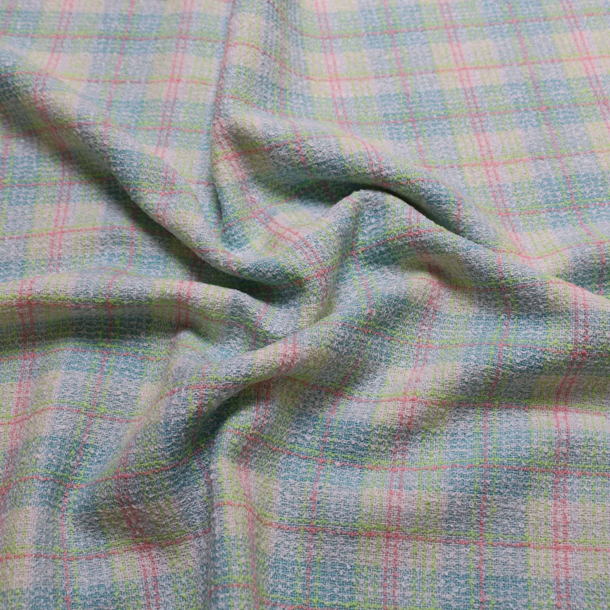mint green and white wool blend boucle dressmaking fabric with check pattern