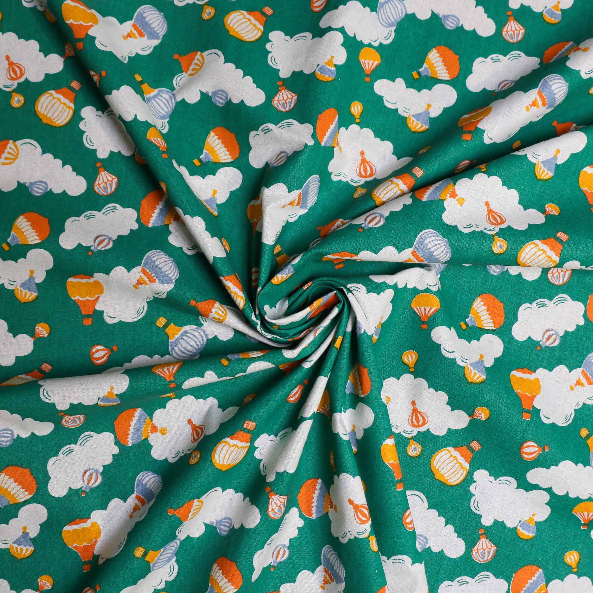 sustainable retro green cotton poplin dressmaking fabric with hot air balloon clouds print
