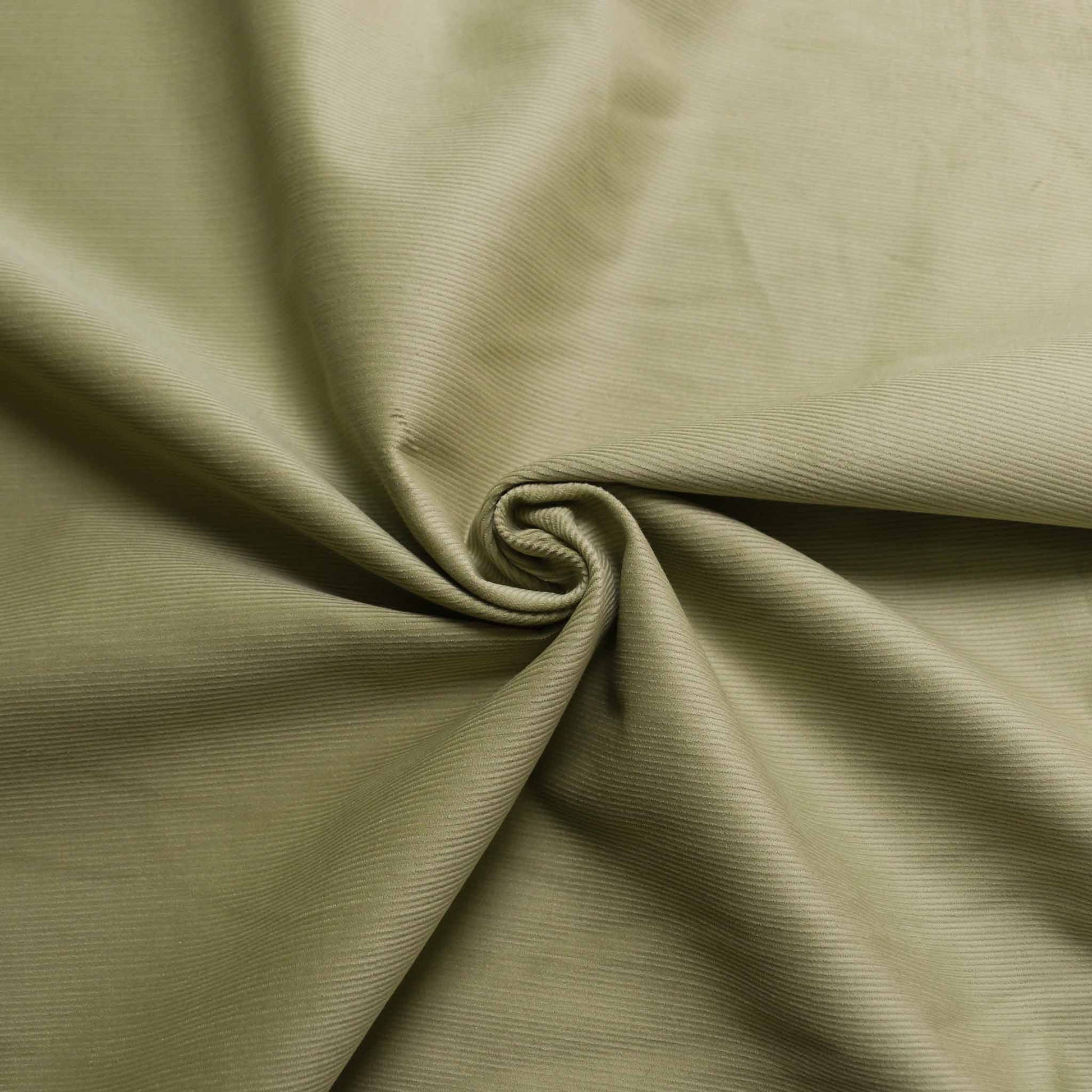 dusky lime green colour 20 wale dressmaking corduroy fabric
