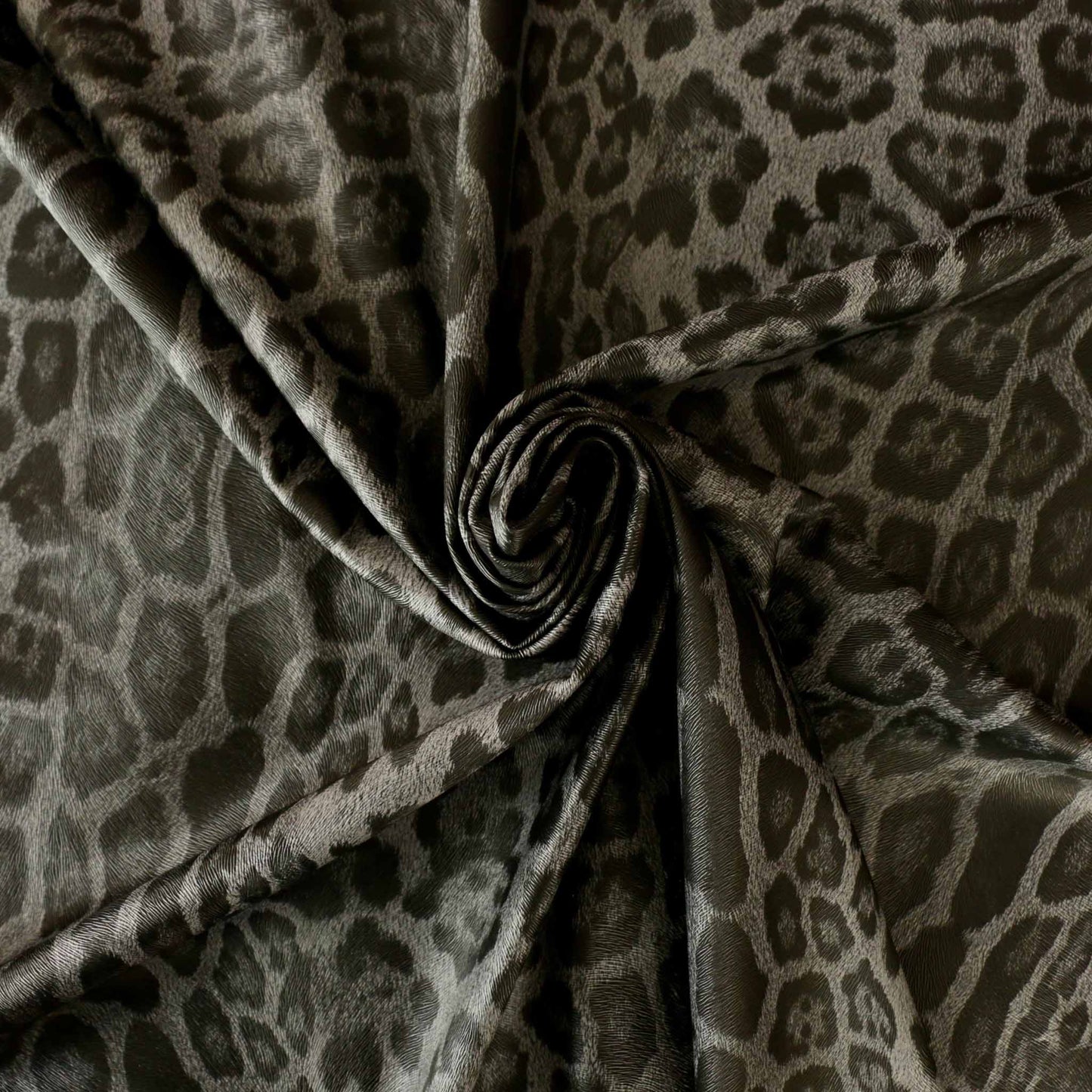 leatherette faux leather dressmaking fabric with jaguar skin print in grey and black