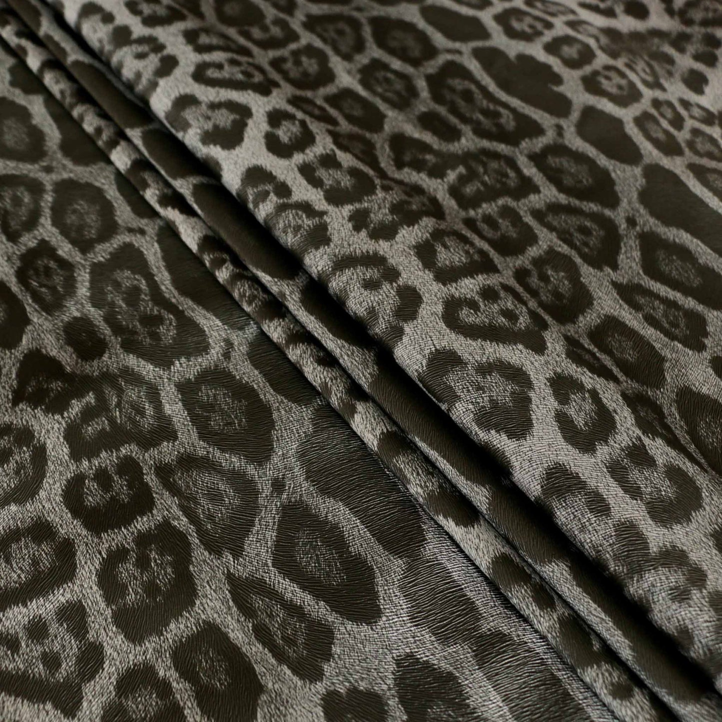 black and grey jaguar skin vinyl faux leather dressmaking fabric