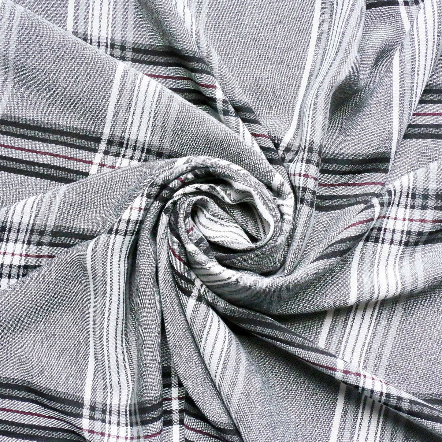 grey viscose challis dressmaking fabric with white and black check pattern