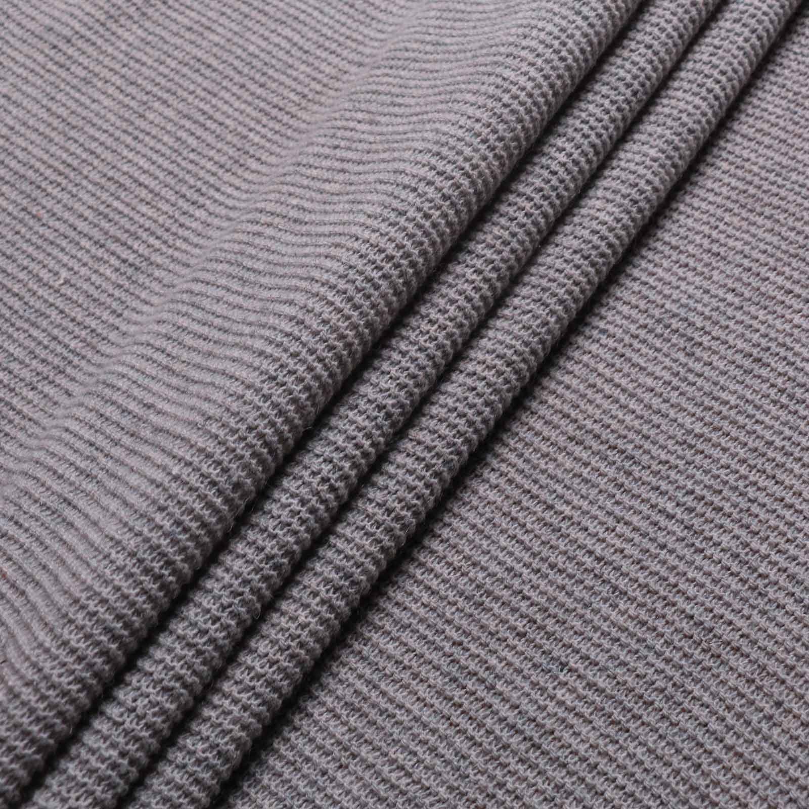 folded pale grey purl wool jersey knit dressmaking fabric