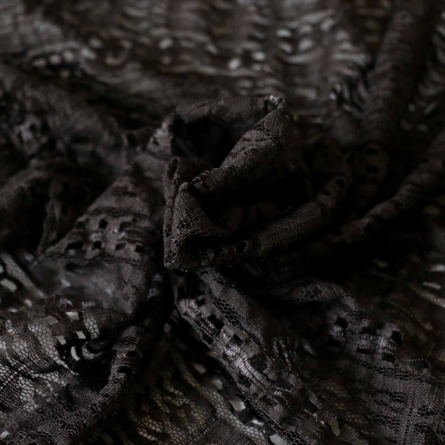 grey lace dressmaking fabric with decorative satin ribbon