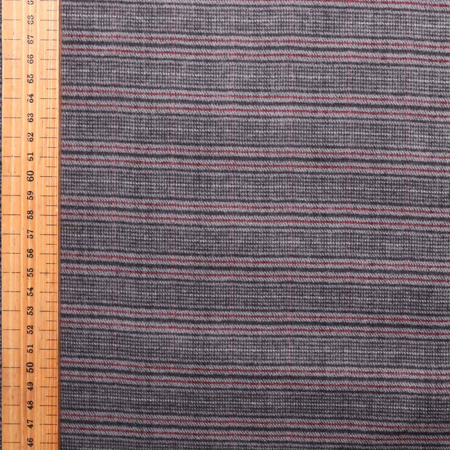 metre brushed cotton dressmaking fabric with grey red and black check design