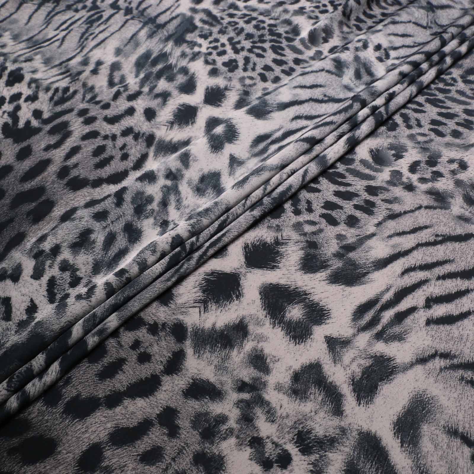 folded satin animal print fabric in grey for dressmaking