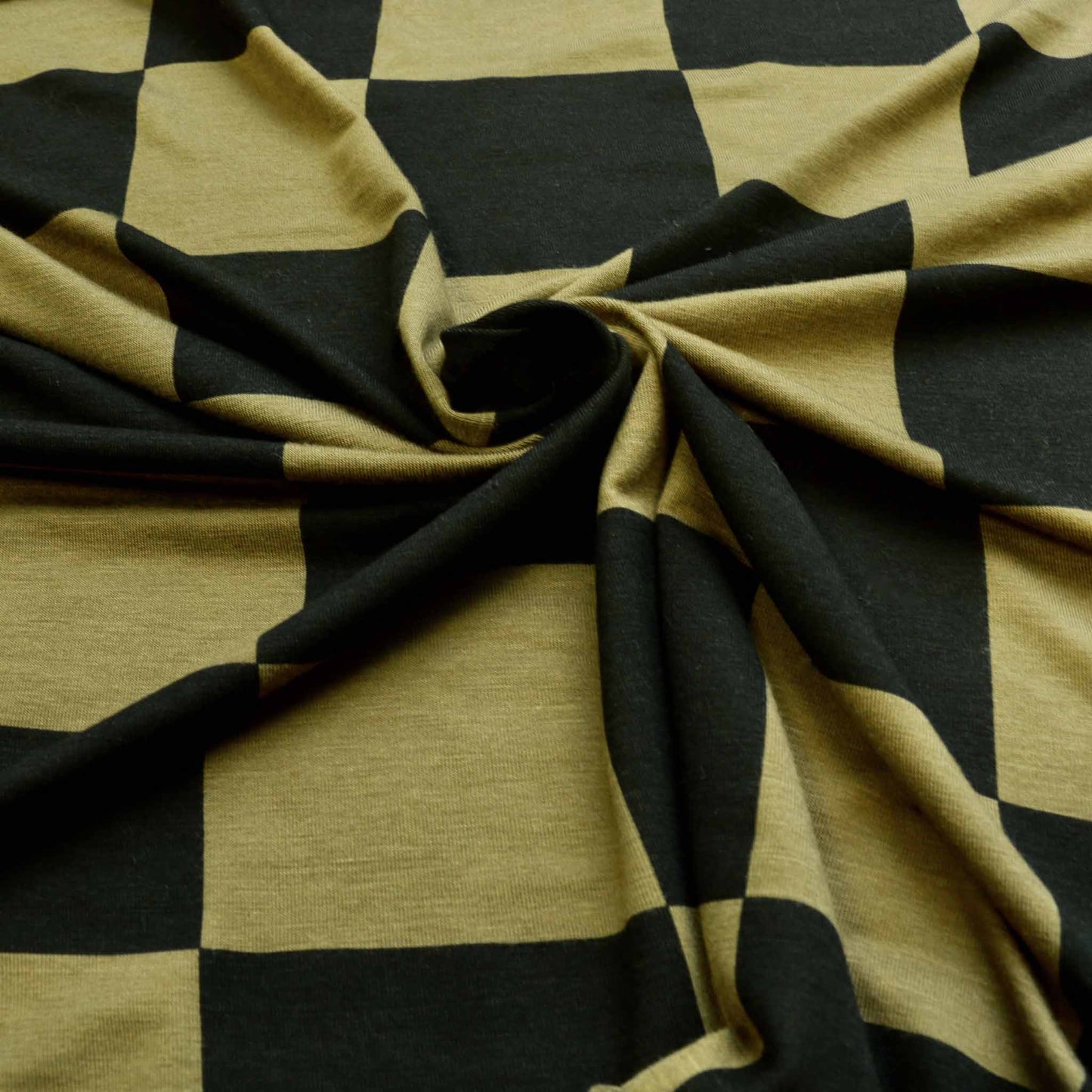 jersey viscose dressmaking fabric with large khaki green and black check design