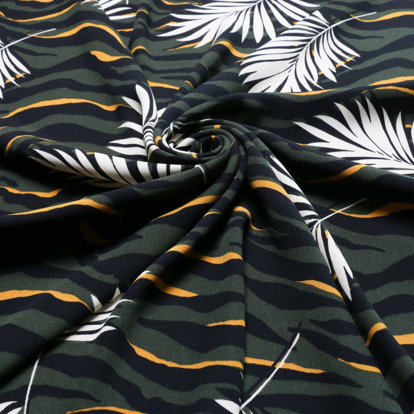 tropical leaf print challis dressmaking fabric with zebra animal print pattern