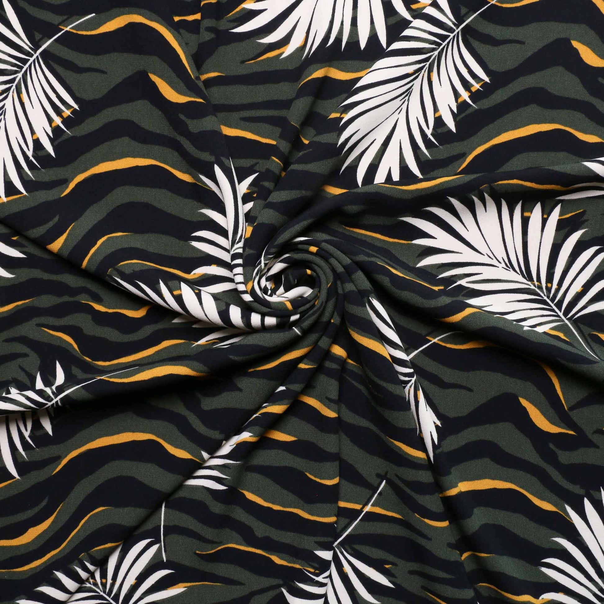 challis dressmaking fabric with zebra print and tropical leaf design in khaki and yellow colours