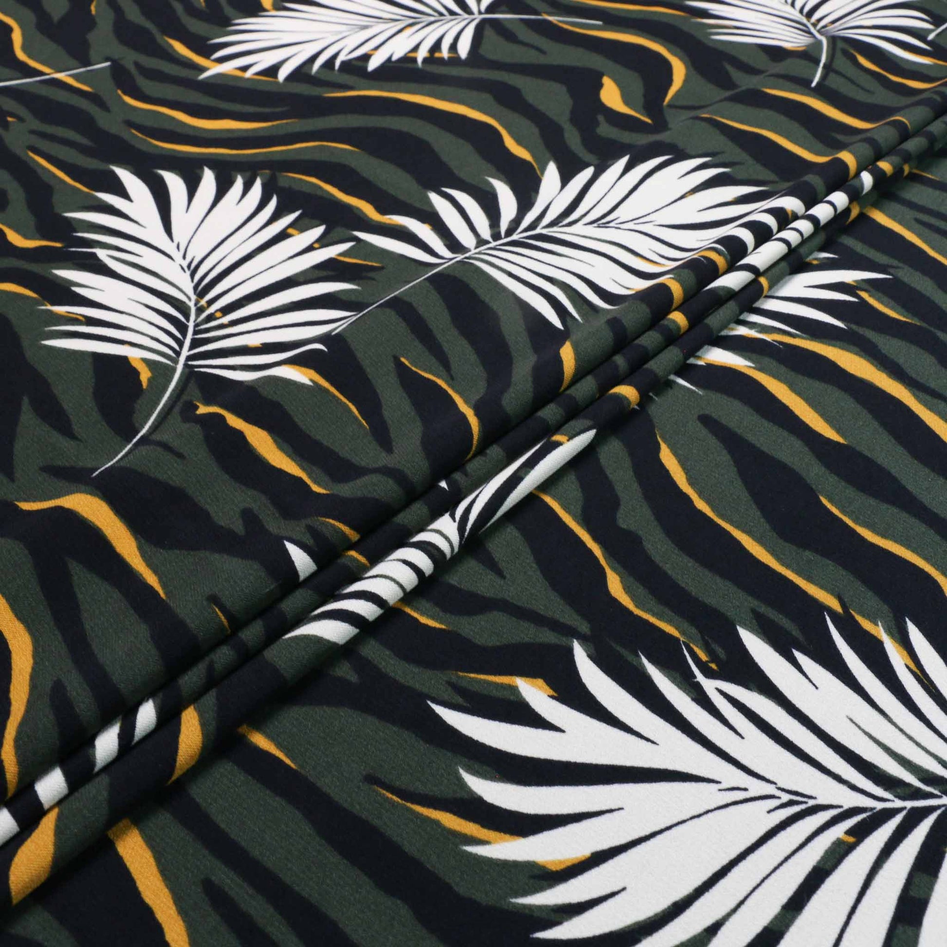tropical leaf and zebra print challis dressmaking fabric in khaki green and yellow