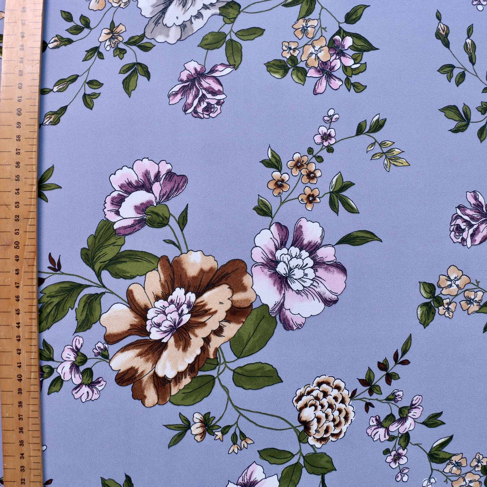 metre pastel coloured flowers on lilac georgette dressmaking fabric